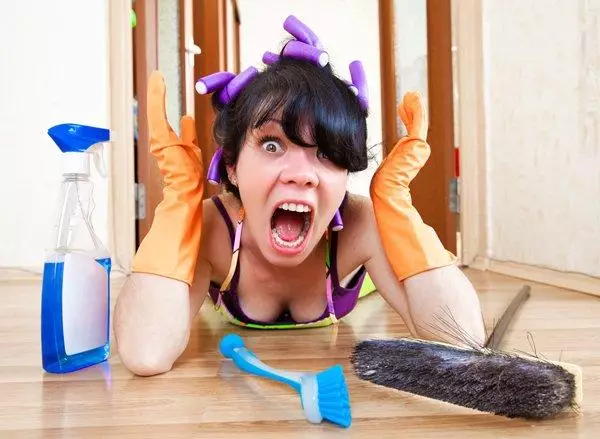 housewife washes a hardwood floor in the house